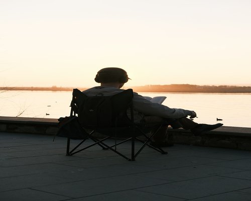Male relaxing outdoors in nature enjoying the sunset