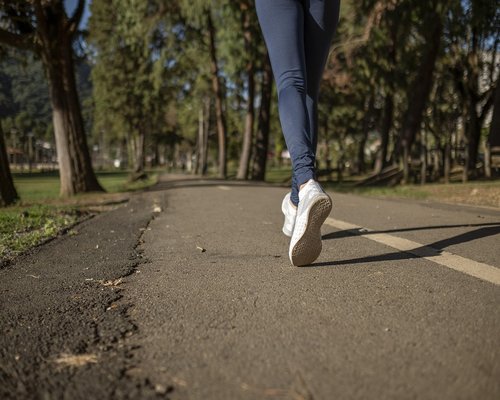 Active healthy man jogging in the park outdoors